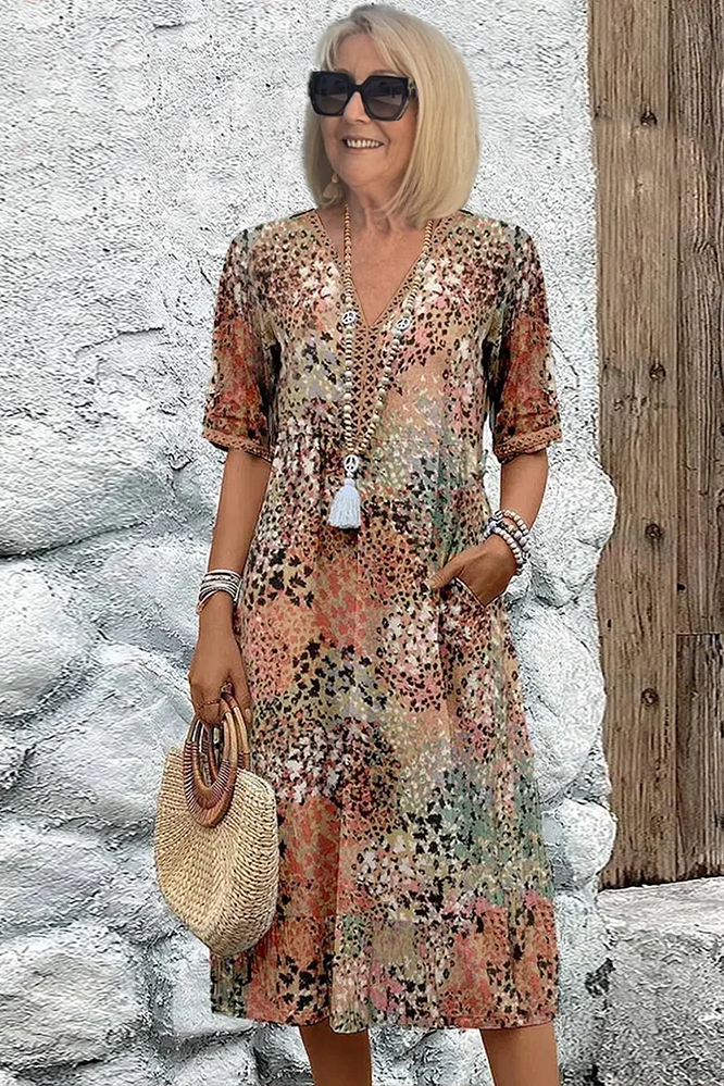 Elegant women's printed midi dress with graceful flow, perfect for spring occasions & summer style.
