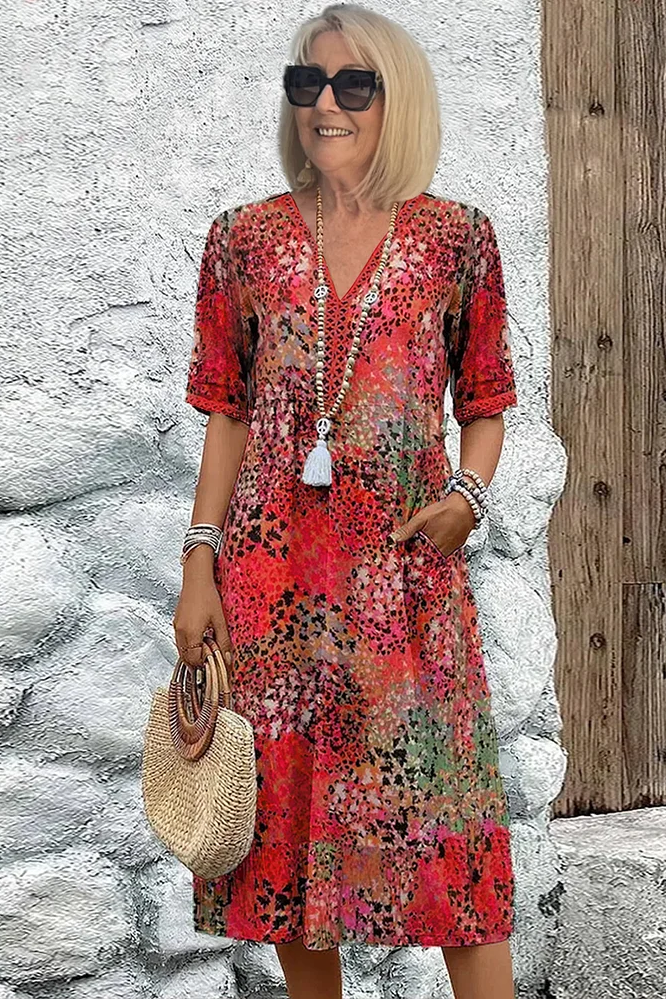 Comfortable women's printed midi dress for spring/summer, featuring elegant patterns & a flattering, flowy silhouette.