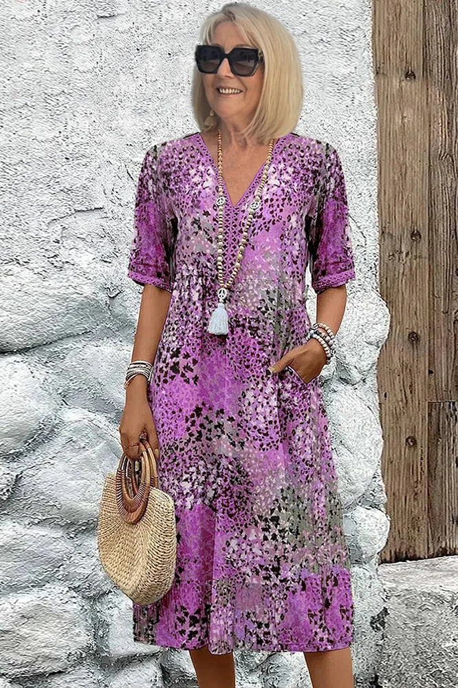 Flowy women's elegant printed midi dress. Comfortable and stylish, perfect for spring and summer parties.