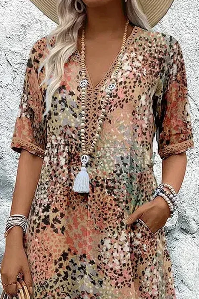 Women's flattering printed midi dress with unique design, offering a graceful flow & elegant look for spring fashion.