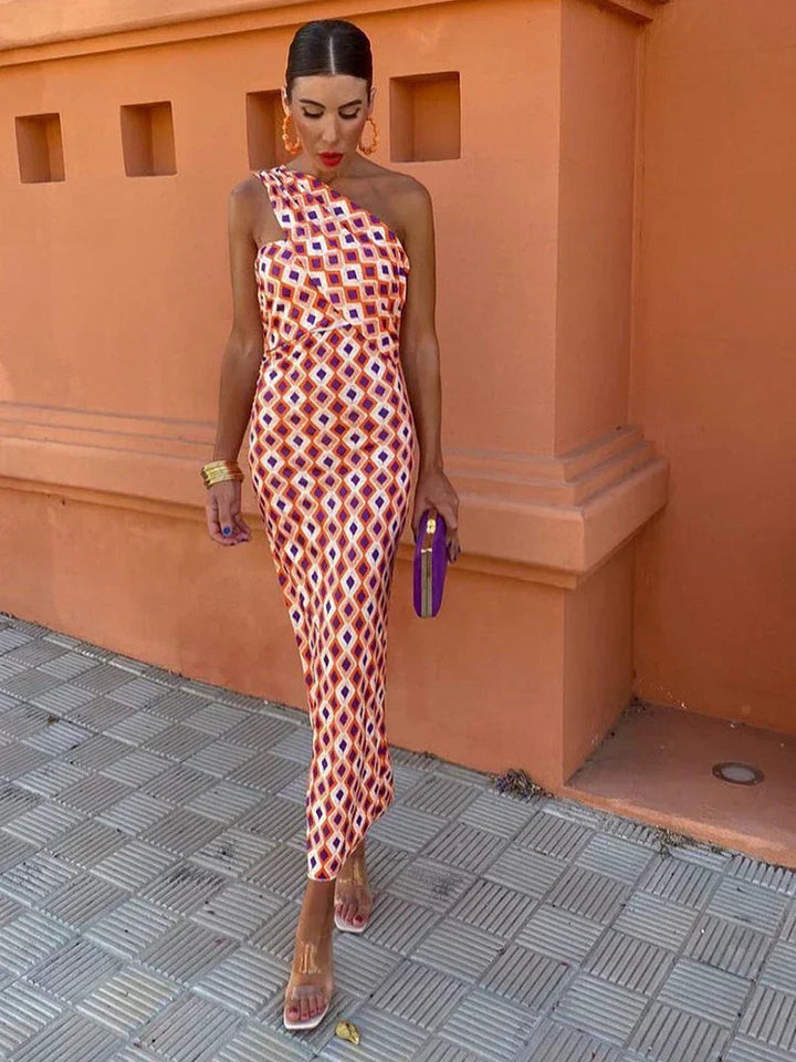 Elegant women's printed one-shoulder maxi dress with floral pattern, perfect for a summer party.