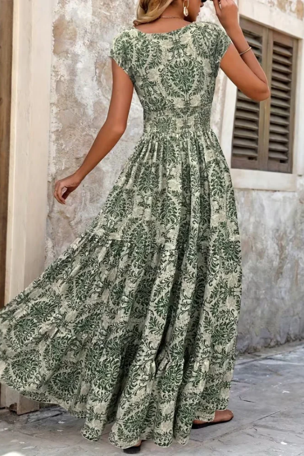 Elegant women's printed v-neck flowing maxi dress for summer. Perfect casual or vacation daywear.