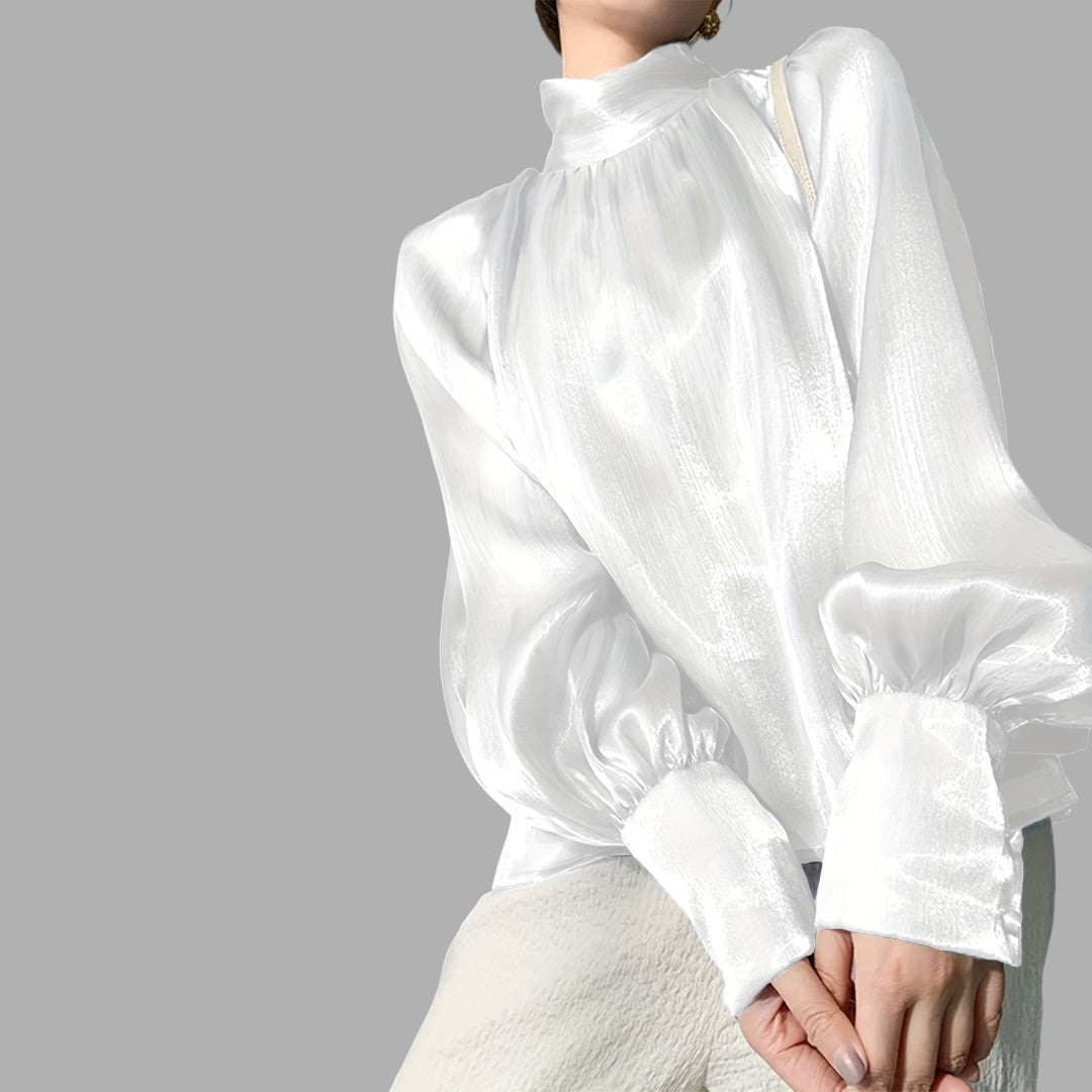 Stylish women's long sleeve blouse with elegant puff shoulders, a chic addition to any wardrobe.