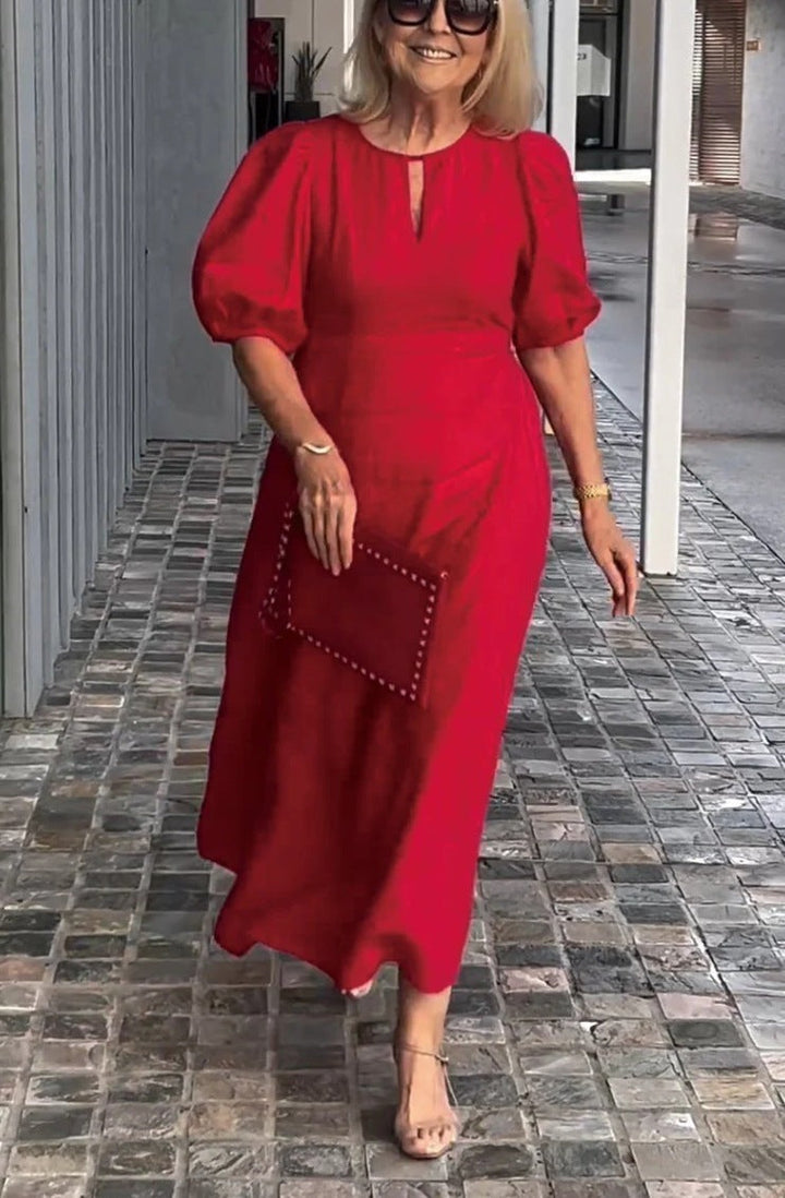 Stylish women's midi dress with chic puff sleeves & keyhole neckline. Ideal for formal parties.