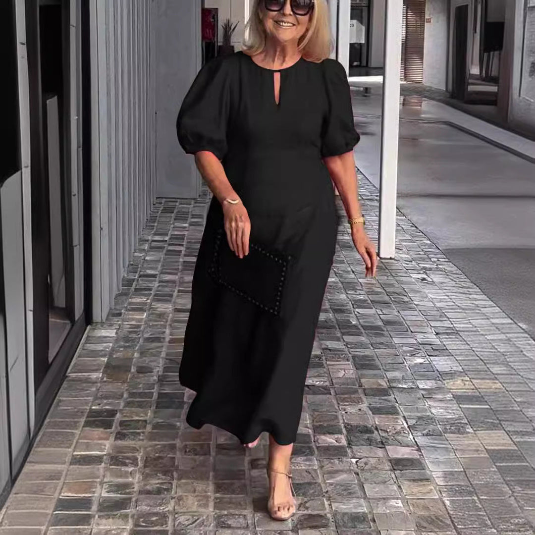 Sophisticated A-line midi dress for women featuring elegant puff sleeves & a keyhole detail.