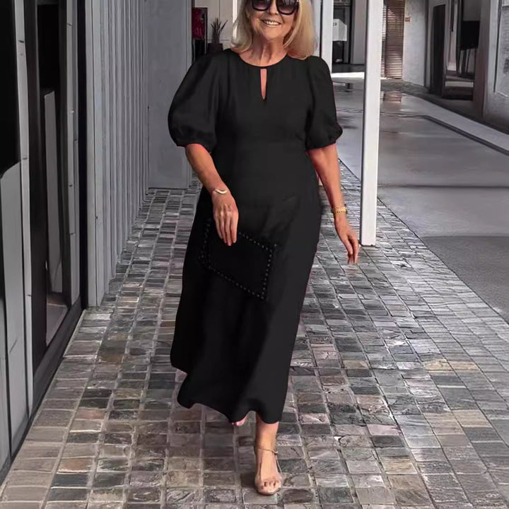 Sophisticated A-line midi dress for women featuring elegant puff sleeves & a keyhole detail.