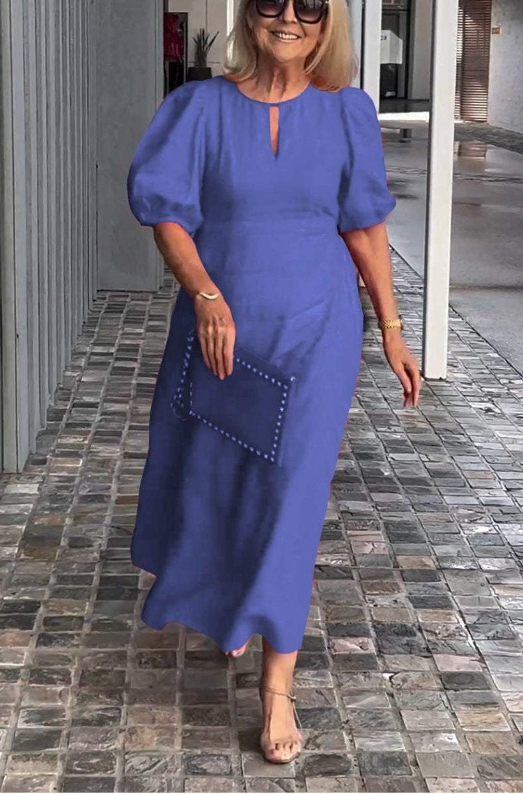 Beautiful women's formal party dress, a midi length A-line with elegant puff sleeves & keyhole.
