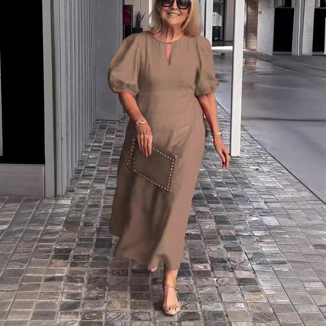 Chic women's special occasion A-line midi dress with stylish puff sleeves & delicate keyhole.