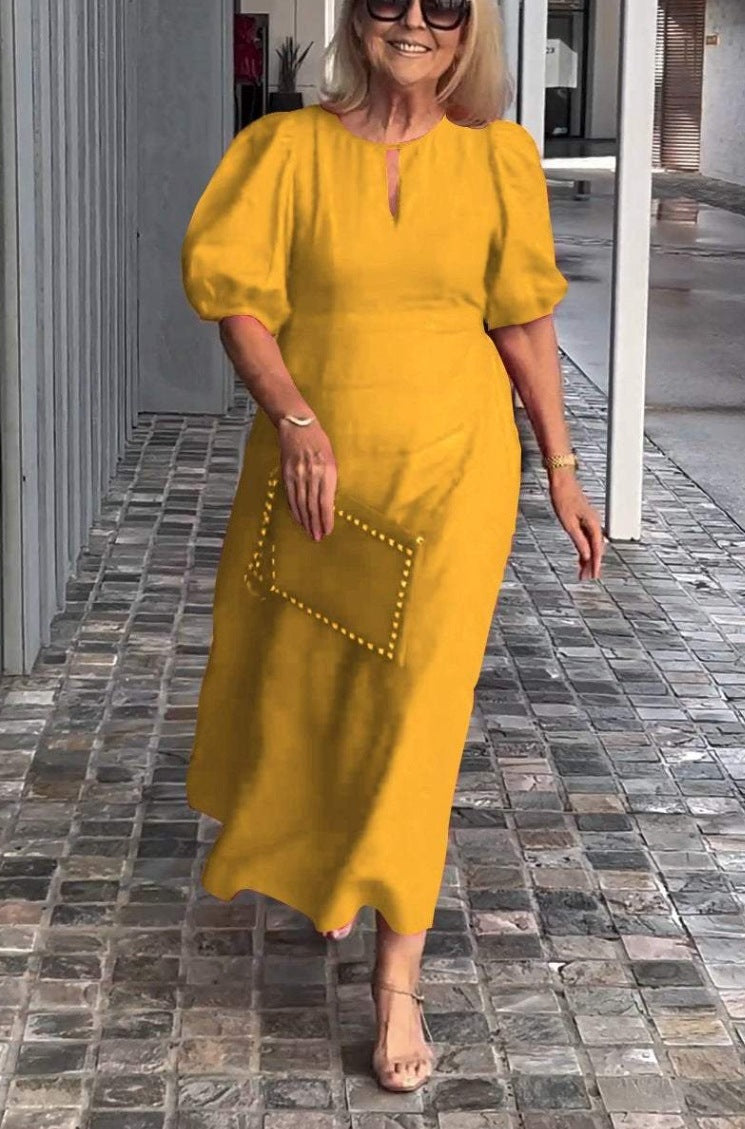 Versatile women's elegant midi dress for wedding guests & parties. Features puff sleeves, keyhole.
