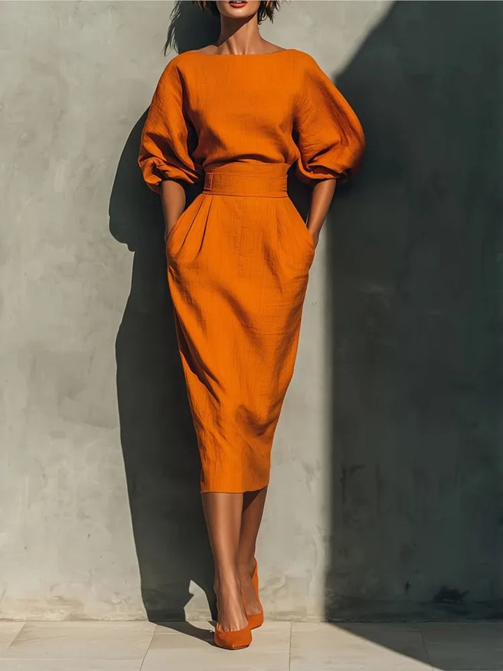 Elegant women's puff sleeve midi dress with practical pockets, ideal for versatile spring and summer fashion.