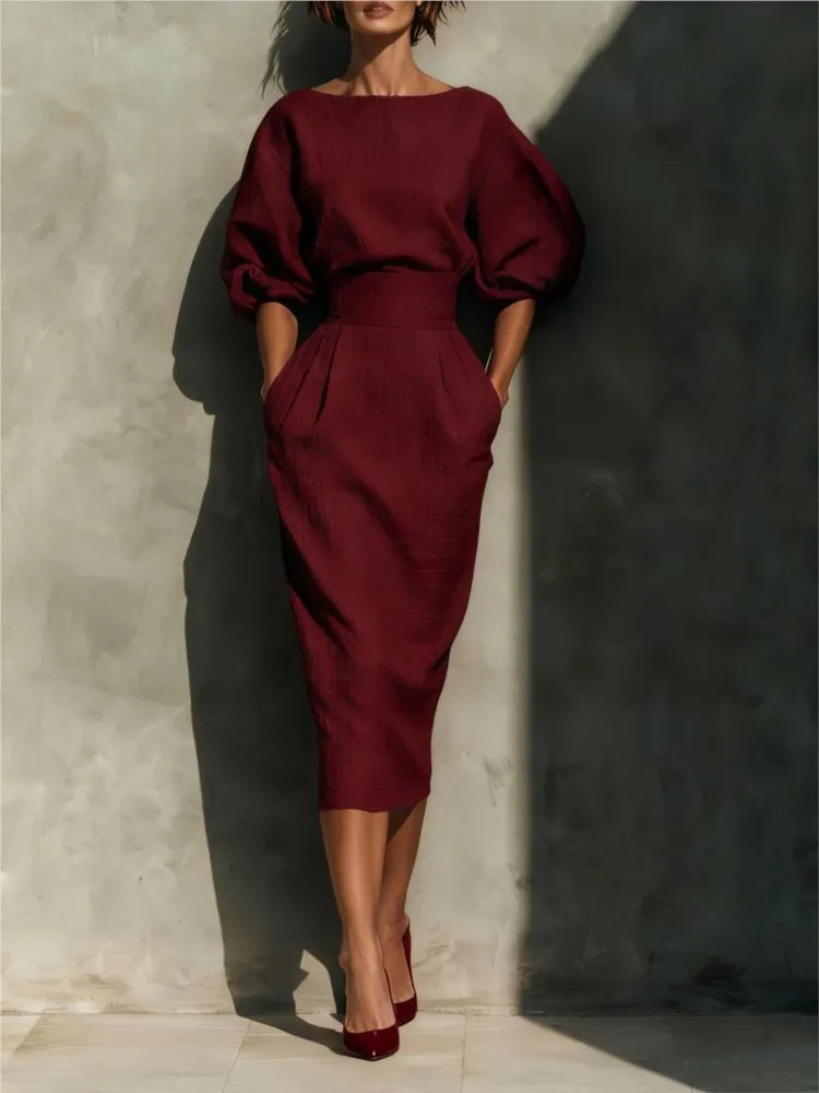 Modern women's puff sleeve midi dress, perfect for workwear or casual spring/summer elegance, featuring pockets.