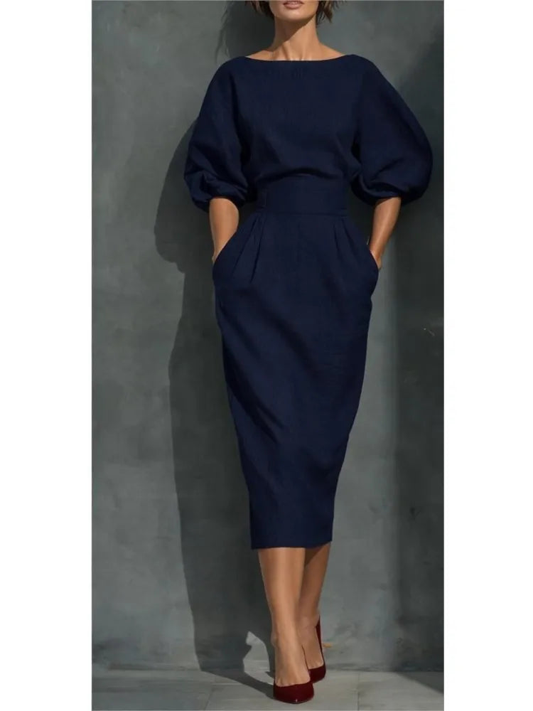 Stylish women's round neck midi dress with charming puff sleeves and convenient pockets, suitable for various occasions.