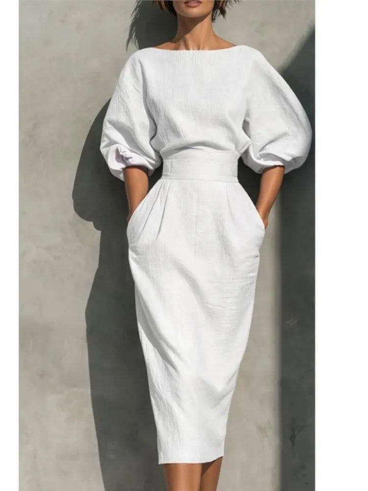 Versatile women's midi dress with puff sleeves & pockets, great for casual outings, work, or elegant evening wear.