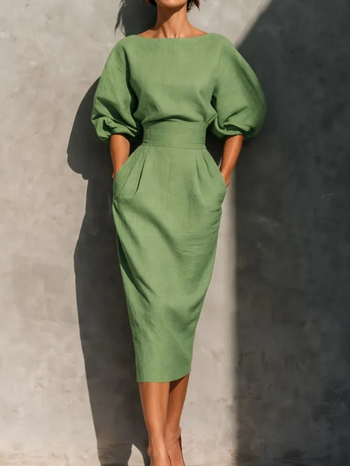 Comfortable women's puff sleeve midi dress with pockets, ideal for chic summer and spring casual wear.