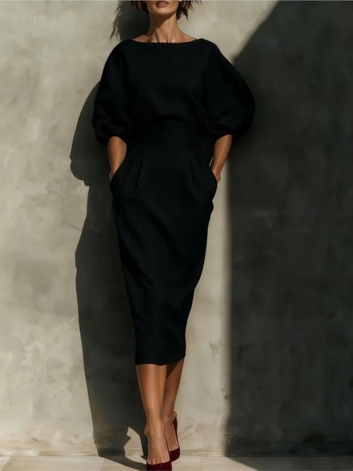 Chic women's puff sleeve midi dress with pockets, a versatile and elegant option for modern spring/summer fashion.