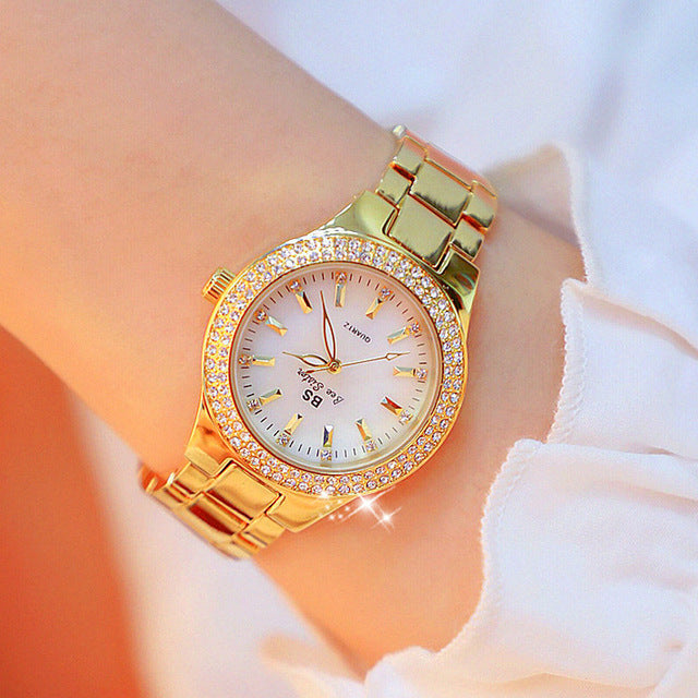 Stylish women's two-tone quartz watch, glossy stainless steel band. Elegant analog timepiece for daily wear.
