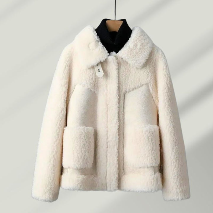 Detail of the sherpa lining inside a women's Renard wool blend winter coat, emphasizing warmth