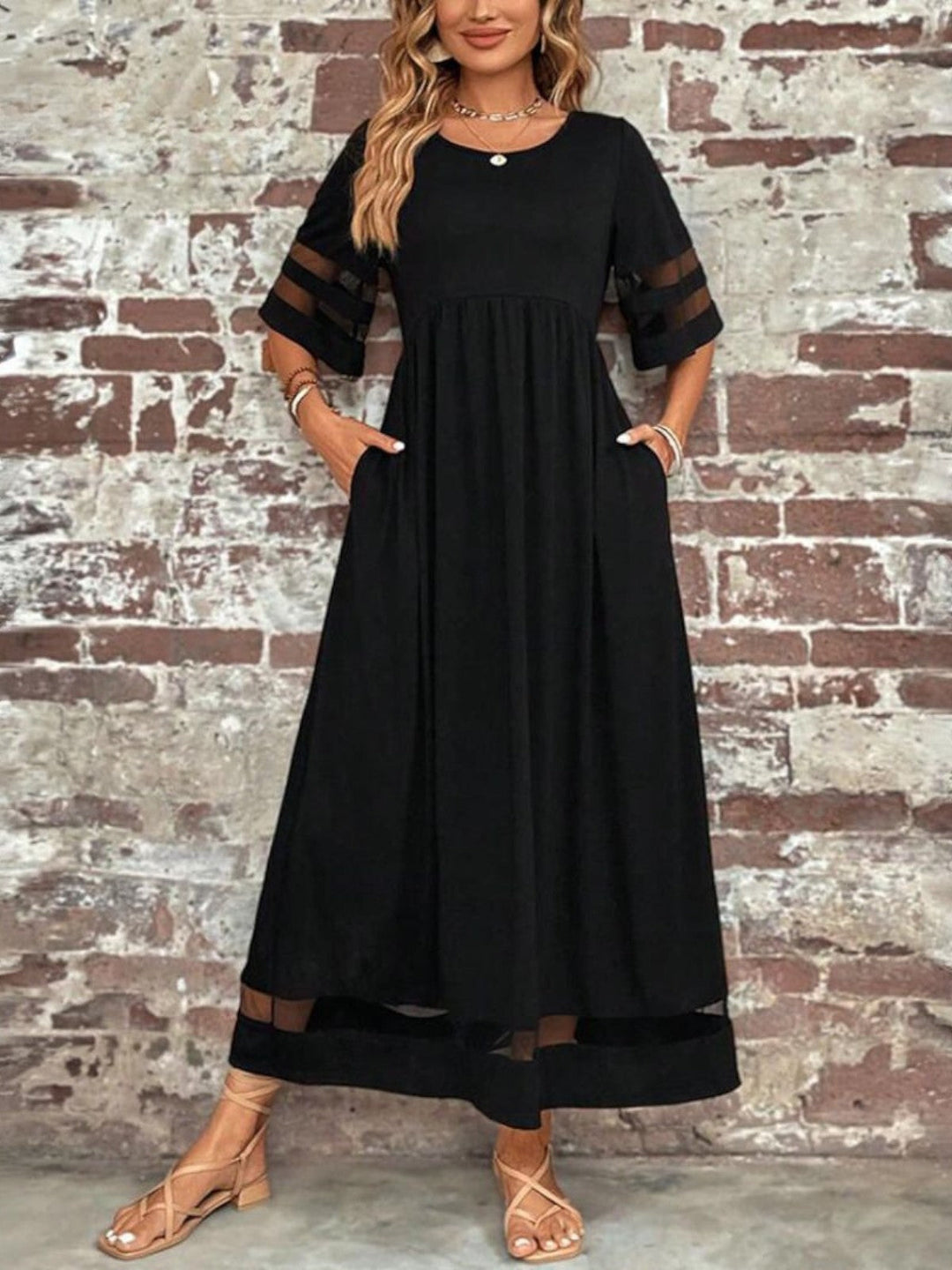 Comfortable women's elegant long maxi dress with round neck and sheer short sleeves, suitable for various events.