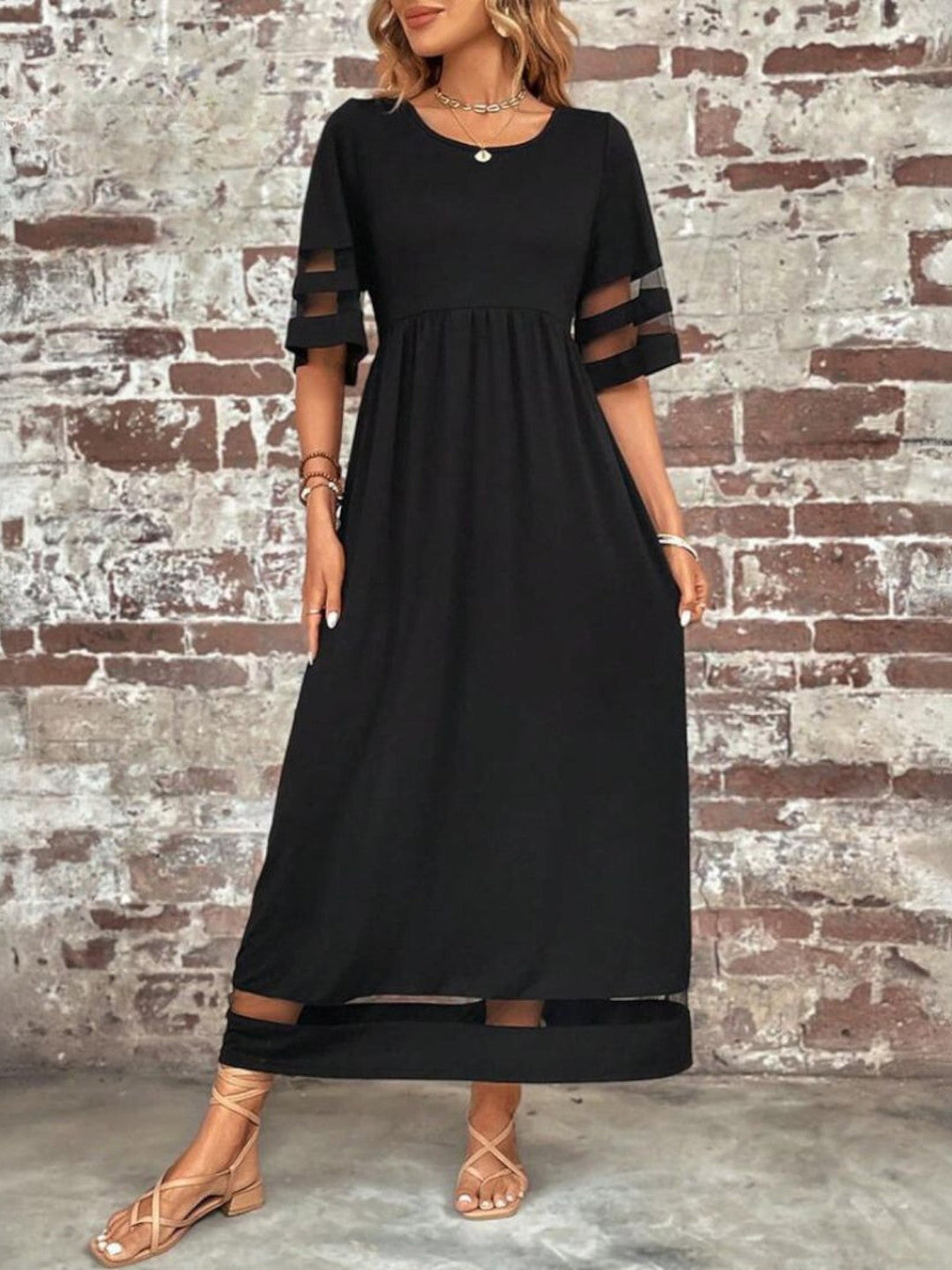 Casual women's summer maxi dress with a round neck, delicate sheer sleeves, and a comfortable long fit.