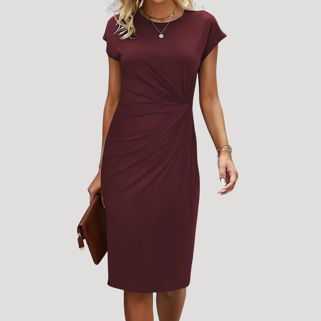 Stylish women's ruched midi dress with cap sleeves. A versatile and elegant choice for office fashion.