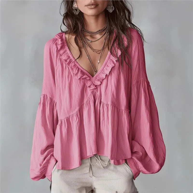 Fashionable women's V-neck ruffle blouse with elegant puff sleeves & a relaxed, flowy silhouette. Perfect for style.