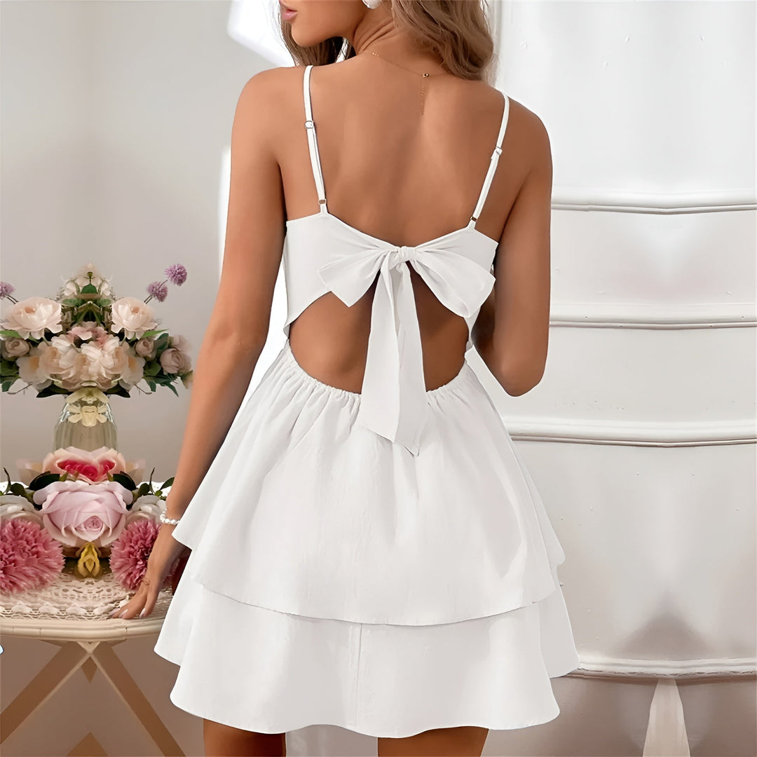 A-line women's ruffle mini dress with spaghetti straps, perfect as a stylish summer day dress.