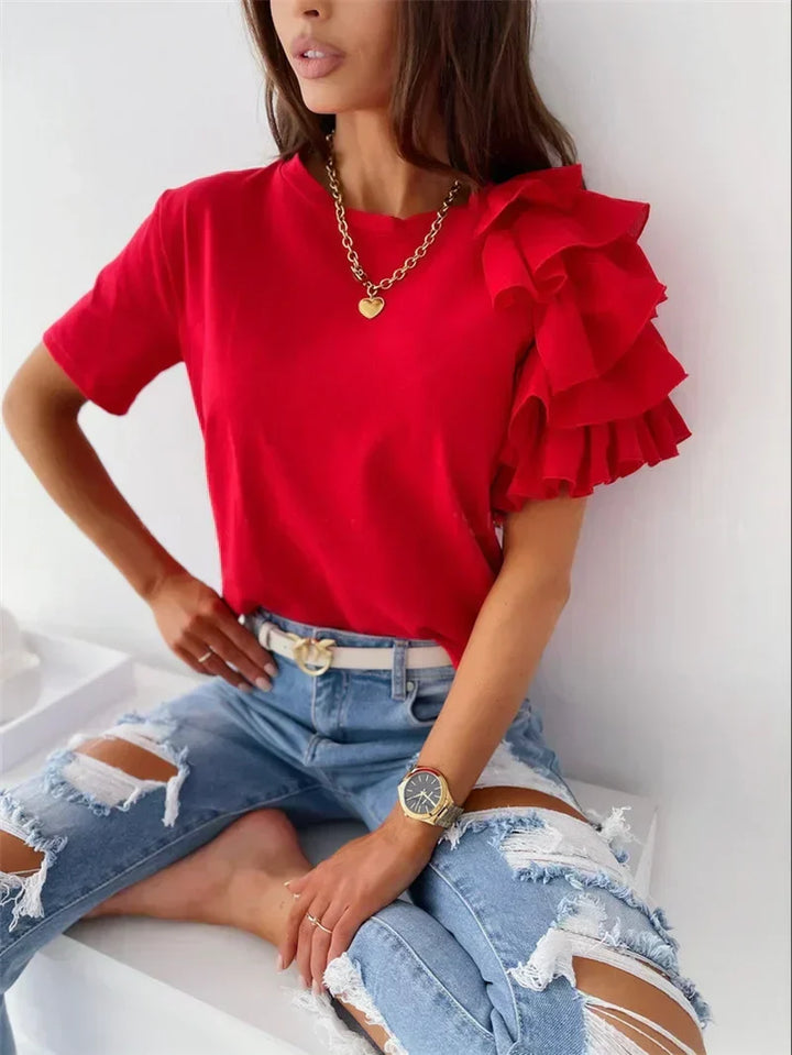 Elegant women's ruffle sleeve top with a unique design, ideal for chic casual wear or stylish evening outfits.