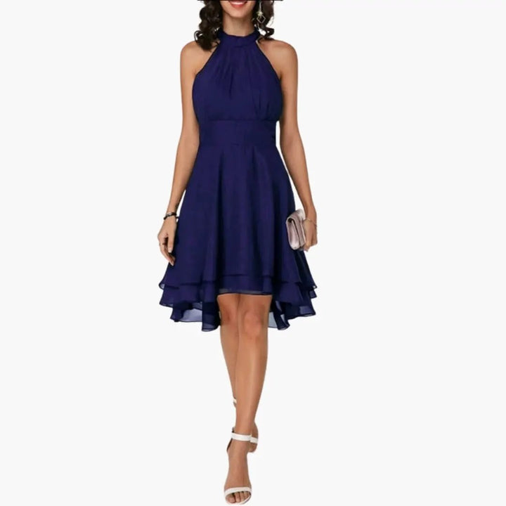 Women's elegant ruffle sleeveless dress. Round neck, knee-length, perfect casual or day-to-night style.