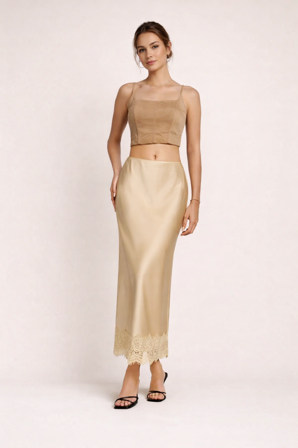 Elegant women's satin finish maxi skirt with delicate lace hem, perfect for formal evenings & special occasions.