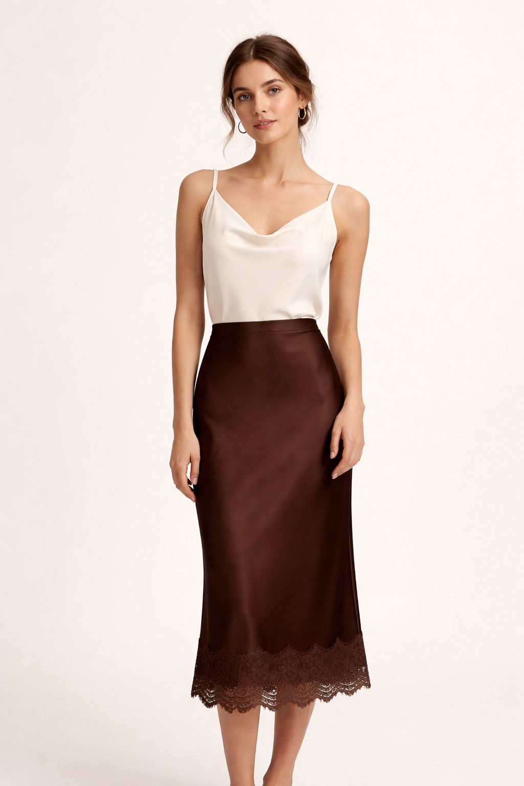 Sophisticated women's satin maxi skirt, flowing gracefully with a stylish lace-trimmed hem, for refined formal looks.