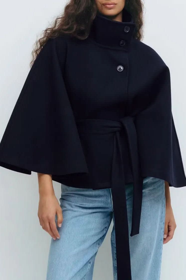 Statement women's self-tie cape with an elegant oversized fit. A chic, timeless layering piece for sophisticated style.