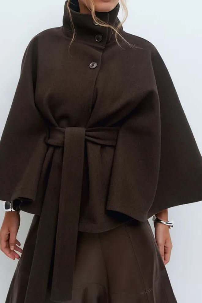 Fashionable women's oversized self-tie cape. Elegant, versatile cover-up for chic autumn and winter outfits.