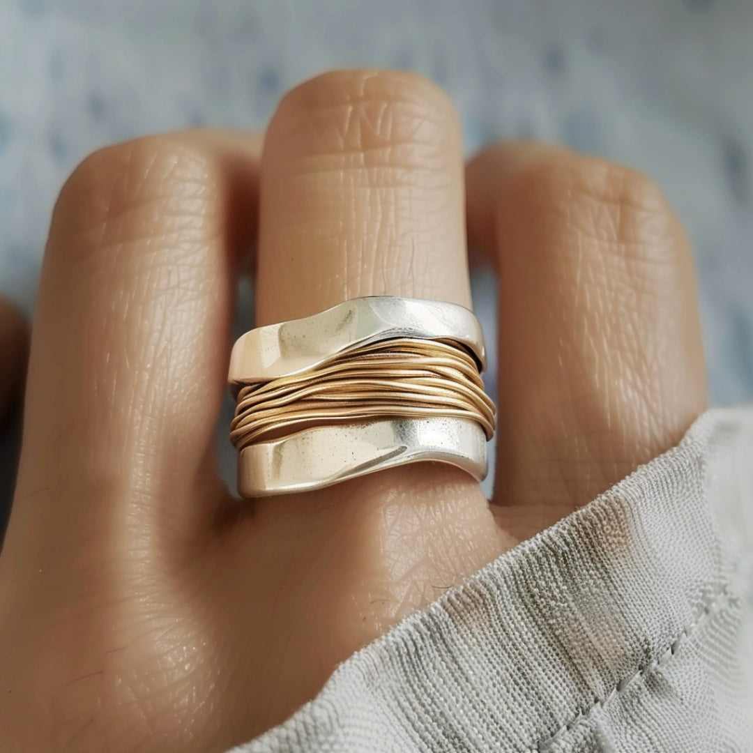 Elegant women's shimmering silver & gold thread ring, versatile fashion jewelry for everyday or special occasions.