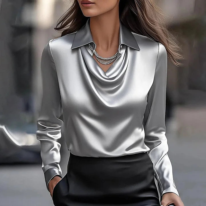 Stylish women's V-neck blouse with a radiant shiny finish. Ideal for elegant office or evening outfits.