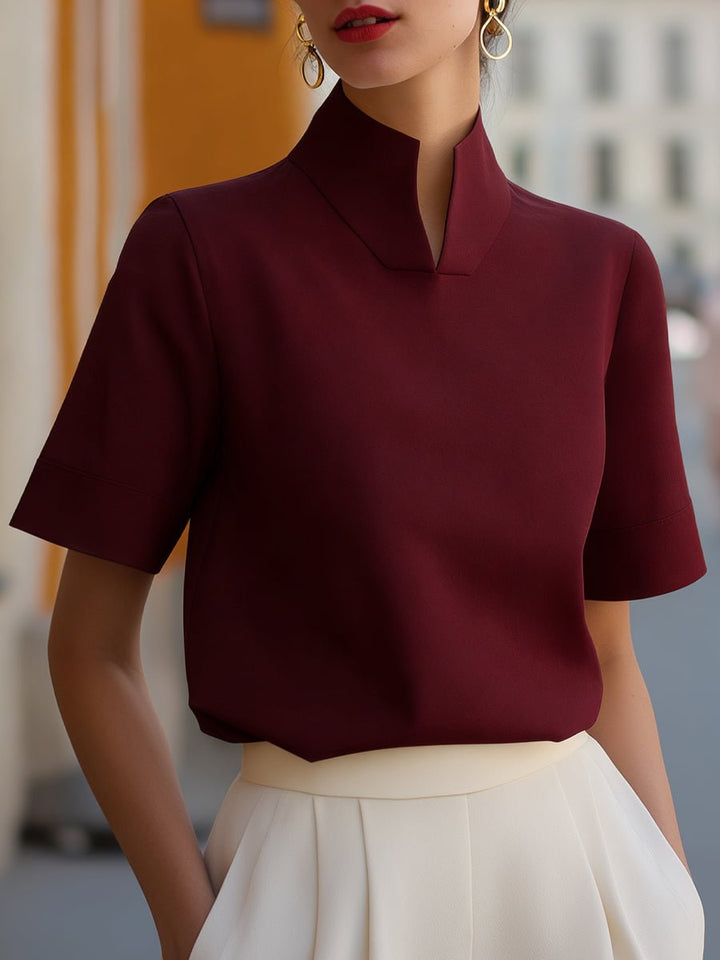 Sophisticated women's short sleeve blouse with mandarin collar. Elegant relaxed fit for comfortable style.