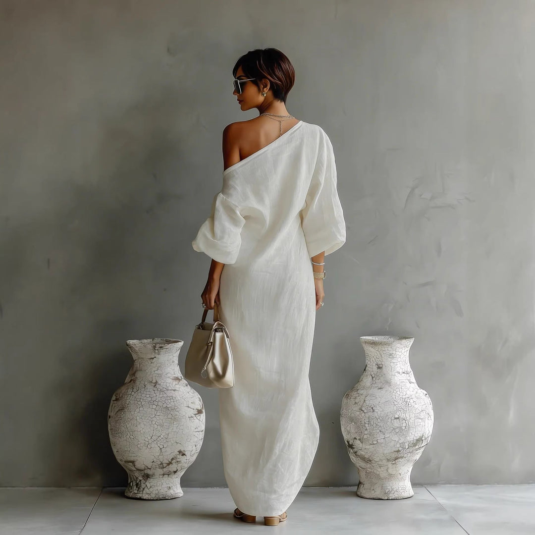 Versatile women's elegant yet casual maxi dress. Features a flattering slanted neck and lantern sleeves.