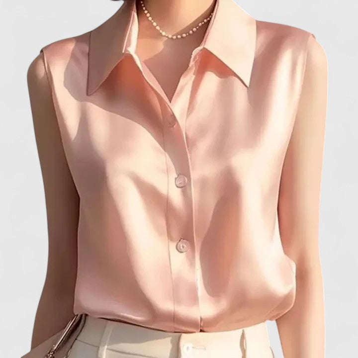 Elegant women's sleeveless blouse, perfect for office wear or chic casual outfits. Sophisticated summer top.