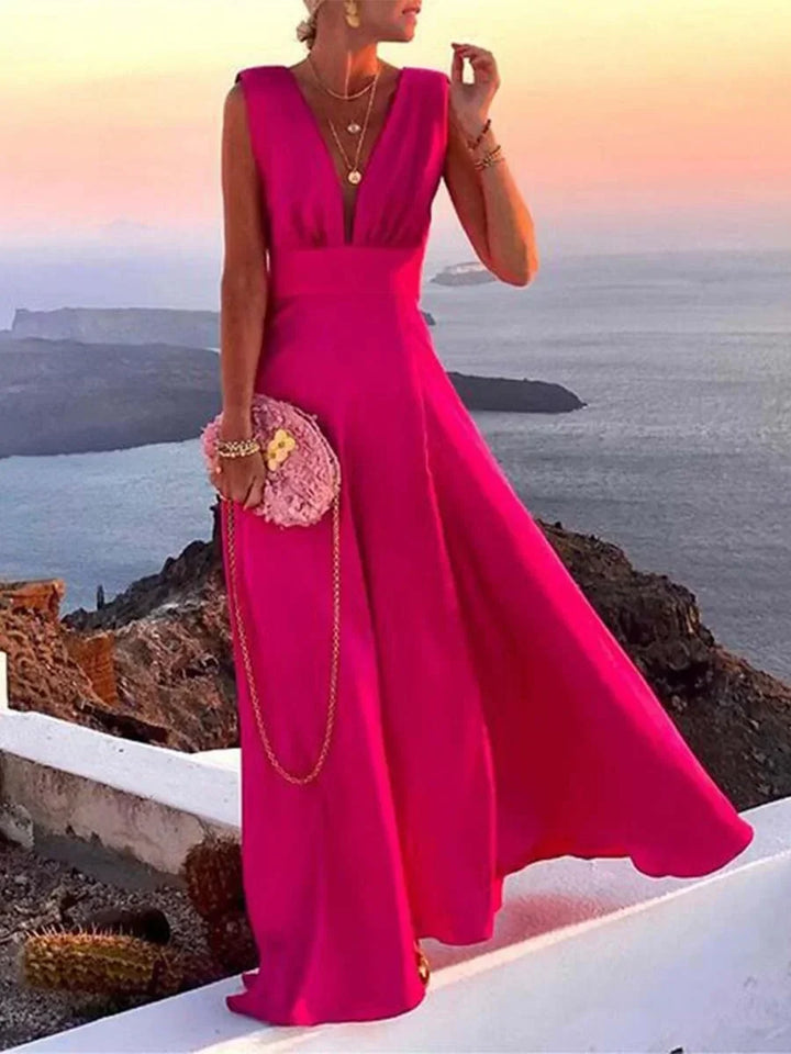 Elegant women's sleeveless deep V-neck flowing maxi dress, perfect for evening wear or summer parties.
