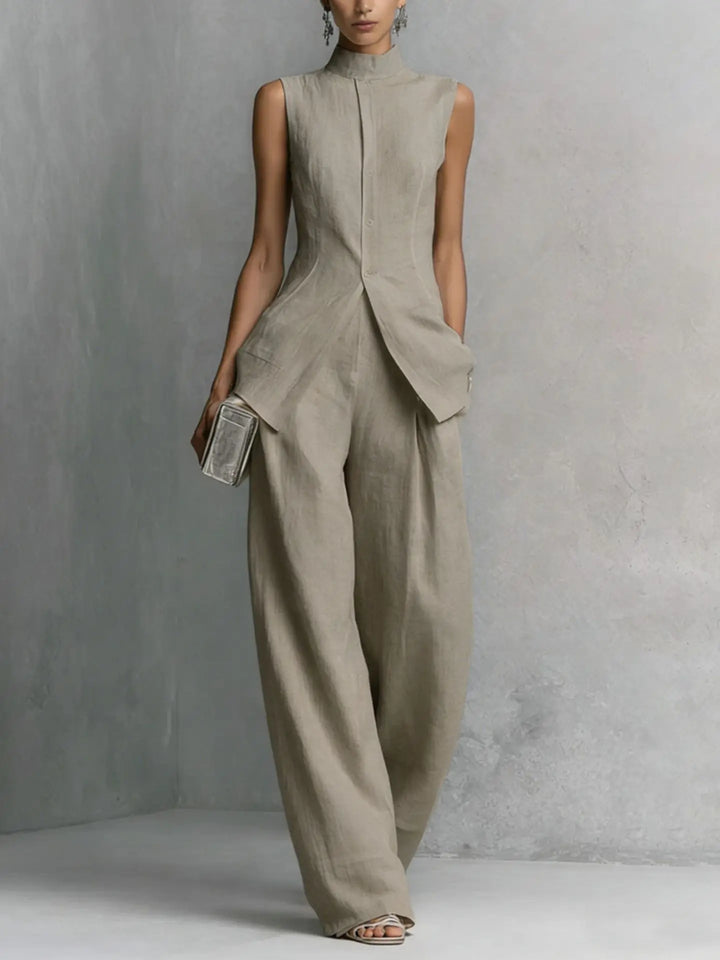 Chic sleeveless high neck wide leg jumpsuit for women. Modern one-piece style, ideal for office or events.
