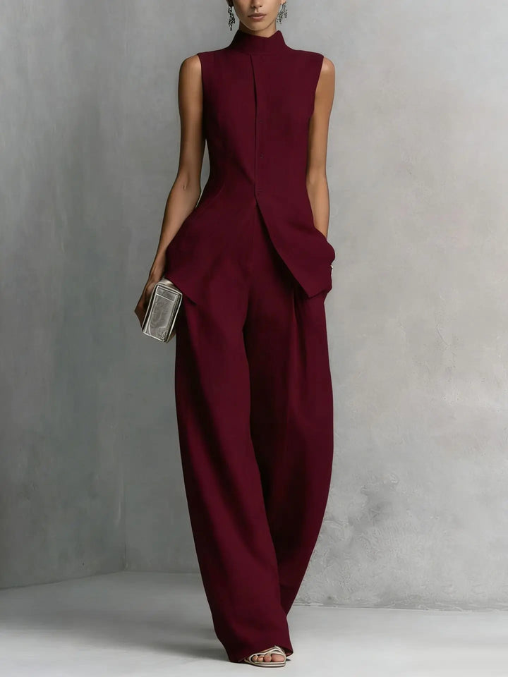 Fashionable women's sleeveless jumpsuit with a high neck and flowing wide leg design. A stylish statement piece.