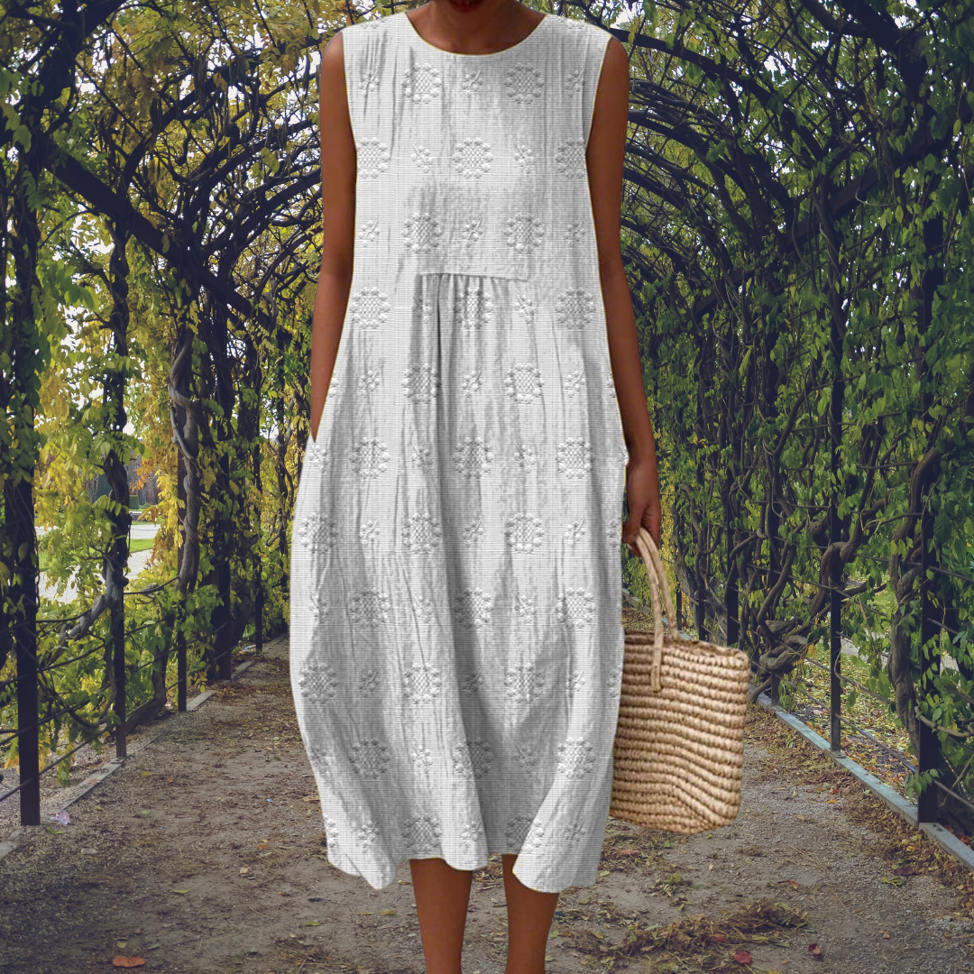 Comfortable women's flowy sleeveless midi dress. Elegant round neck design, perfect textured summer day wear.