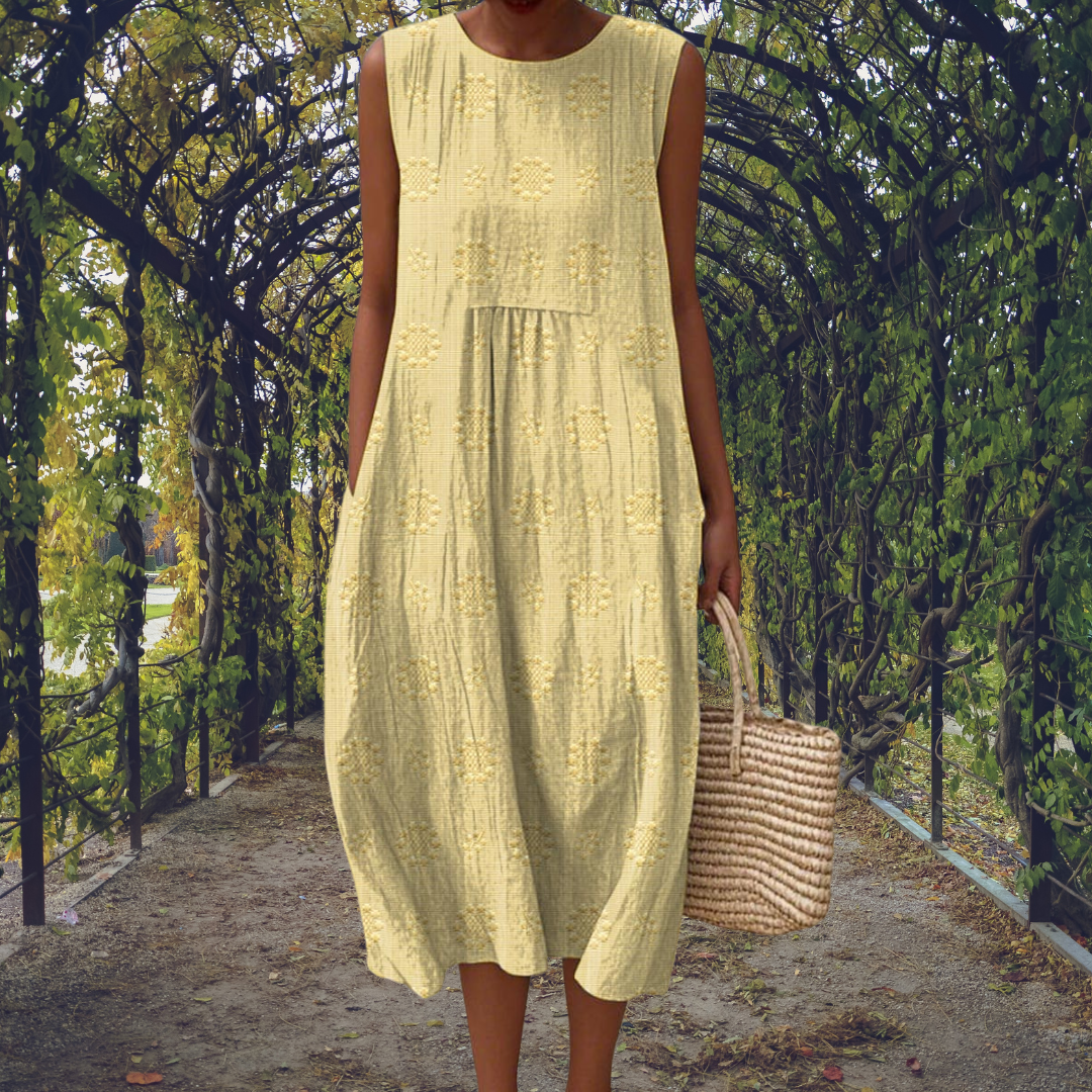 Versatile women's elegant sleeveless midi dress. Textured, flowy fabric, round neck, great for summer day or casual.