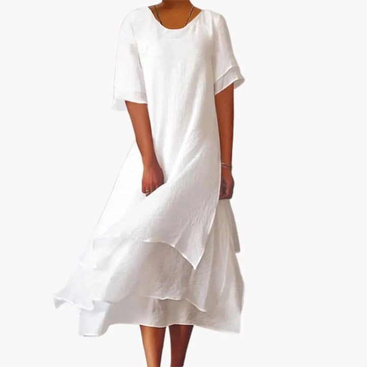 Elegant women's sleeveless midi dress with a round neck. Perfect for summer, sophisticated casual wear, and versatile styling.