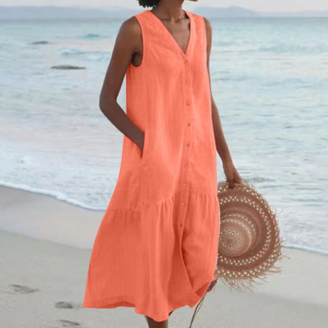 Close-up of a women's sleeveless midi dress with a detailed button-front, V-neck, and elegant tiered skirt fabric.