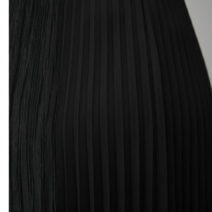 Chic and flowy women's sleeveless pleated maxi dress. Elegant boat neck evening gown for special occasions.
