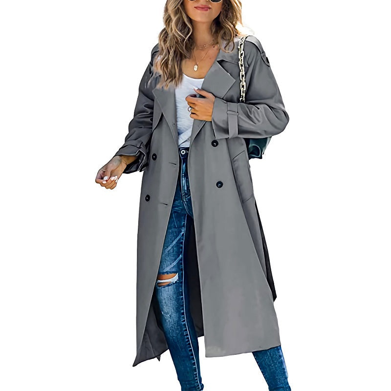 Full-length view of a woman wearing a stylish slim trench coat, showcasing its elegant fall fashion appeal.