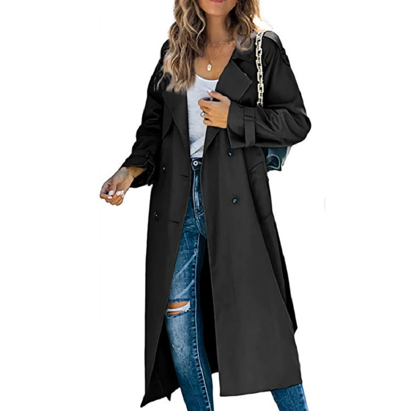 Stylish women's outerwear: a slim-fit trench coat in a classic style, perfect for spring/fall weather.