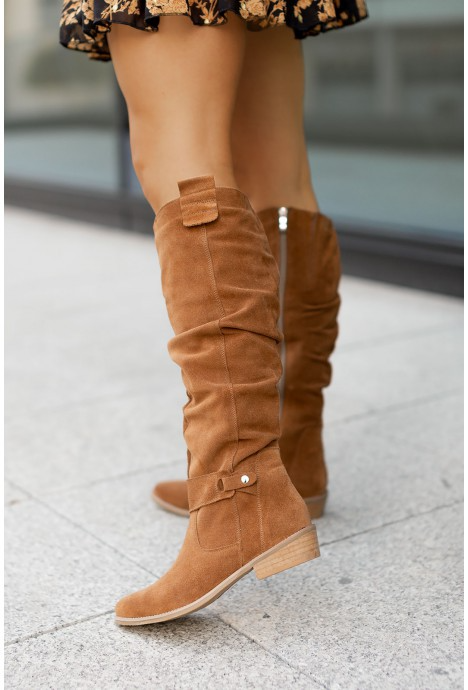 Elegant women's soft suede knee-high boots in a rich brown hue, perfect for fall and winter fashion.