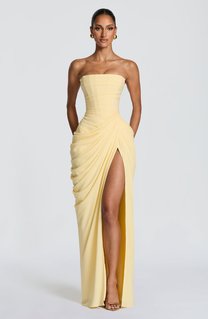 Elegant women's strapless maxi dress with corset bodice, draped waist, and leg split for special occasions.