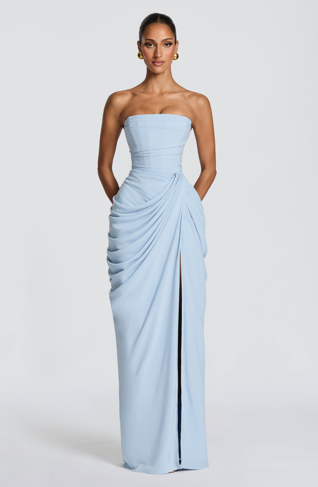 Women's elegant strapless maxi dress with a structured corset bodice and flattering draped waist detail.